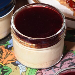 Peanut butter cheesecake on a graham cracker crust, layered with toasted milk bread and peanut praline crunch, topped with a smooth layer of house-made Concord grape jelly.